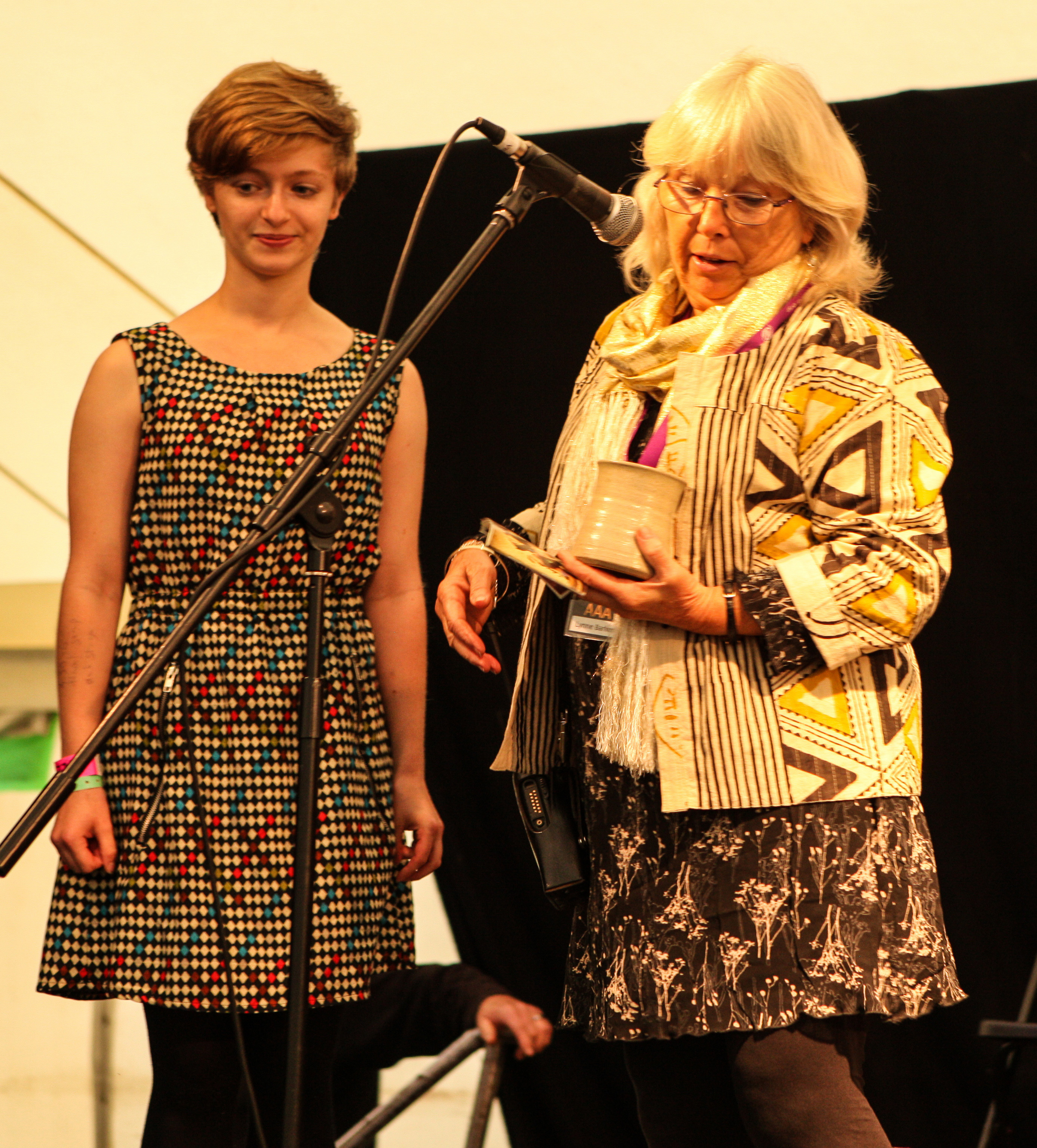 Molly Pipe being presented with the Future of Young Folk Award at Bromyard Folk Festival by director Lynne Barker. Photograph by Lightsmiths Photography.